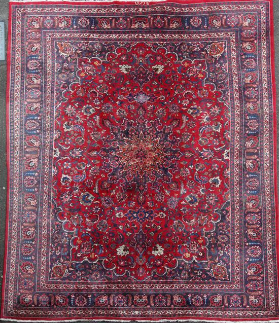 A Tabriz red ground carpet, 292 x 380cm